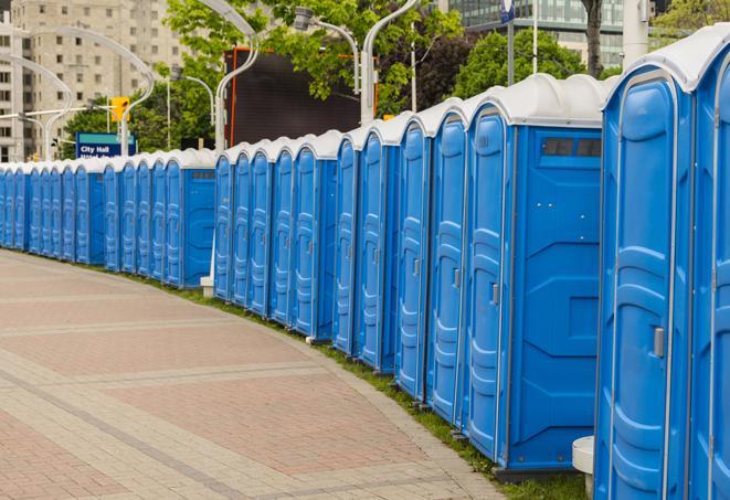 a fleet of portable restrooms ready for use at a large outdoor wedding or celebration in Aventura FL